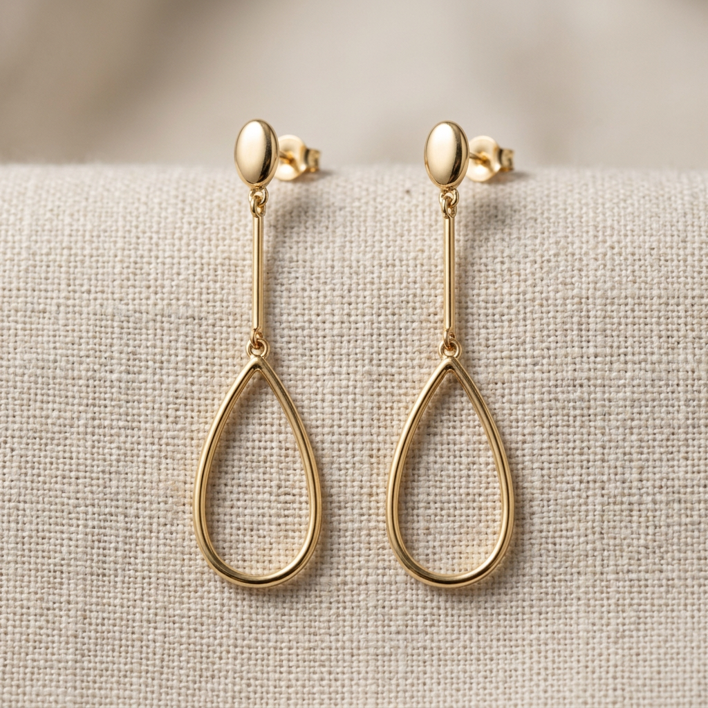 Gold-tone earrings detail close-up