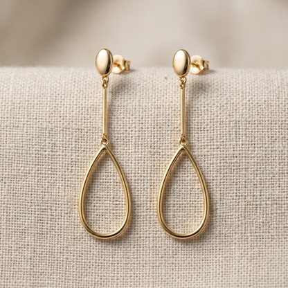 Gold-tone earrings detail close-up